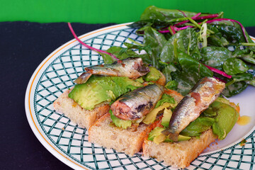 Avocado toast with sardines in olive oil