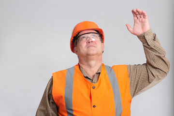 building contractor in hard hatgreeting waving hands on white isolated background, foreman controls work