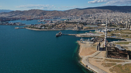 Aerial drone panoramic photo of famous and busy port of Piraeus where passenger ships travel to...
