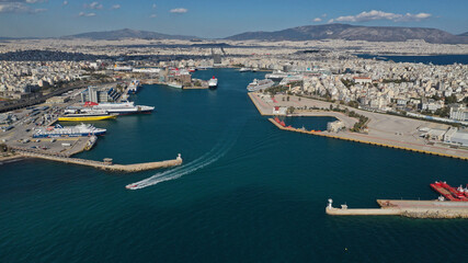 Fototapeta premium Aerial drone panoramic photo of famous and busy port of Piraeus where passenger ships travel to popular Aegean destinations, Attica, Greece