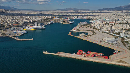 Fototapeta premium Aerial drone panoramic photo of famous and busy port of Piraeus where passenger ships travel to popular Aegean destinations, Attica, Greece