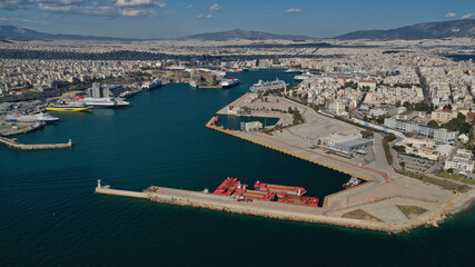 Fototapeta premium Aerial drone panoramic photo of famous and busy port of Piraeus where passenger ships travel to popular Aegean destinations, Attica, Greece