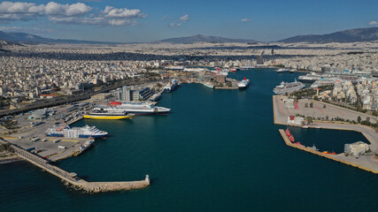 Fototapeta na wymiar Aerial drone panoramic photo of famous and busy port of Piraeus where passenger ships travel to popular Aegean destinations, Attica, Greece