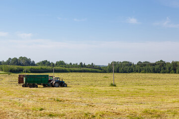 Tractor in the field for agricultural work. 