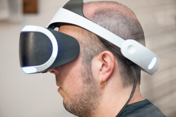 Side view of a man wearing VR visor