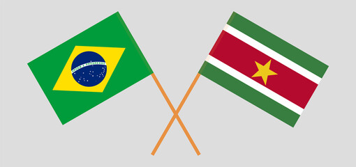 Crossed flags of Brazil and Suriname. Official colors. Correct proportion