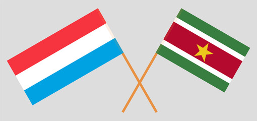 Crossed flags of Luxembourg and Suriname. Official colors. Correct proportion