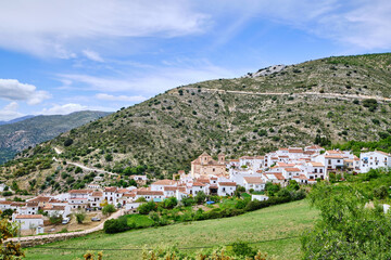 Fototapeta na wymiar View of white village with mountains to the rear, Alpandeire, Serrania de Ronda, Malaga province, Andalusia, Spain.