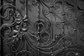 Beautiful decorative wrought metal ornaments for the gate, in black and white