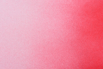 red spray paint on a soft blue colored paper background