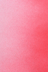 red spray paint on a soft blue colored paper background