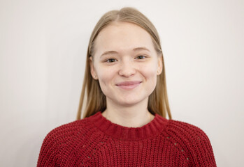 young beautiful blonde woman is sitting near the makeup artist's desk and waiting for makeup, photos before the result