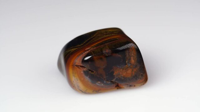 natural jaspelite gemstone on the white background on the turning table