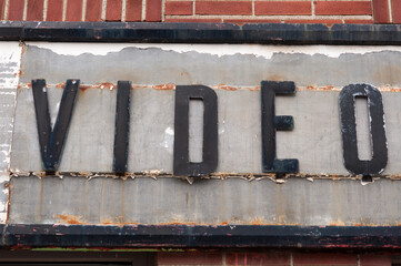 vintage sign of a former video sales and rental shop