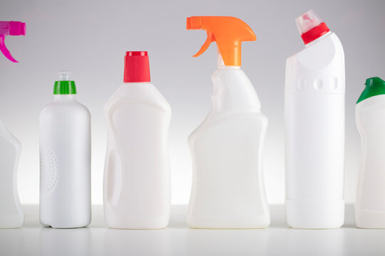 House and office cleaning theme. Set of white bottles with clining liquids on the white  background.
