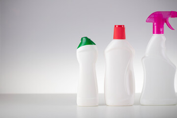 House and office cleaning theme. Set of white bottles with clining liquids on the white  background.