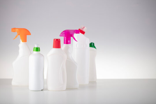 House and office cleaning theme. Set of white bottles with clining liquids on the white  background.