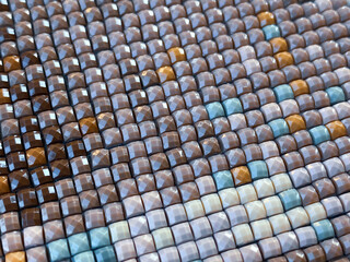 Close-up, colorful square diamond embroidery bright. Hobbies and entertainment.