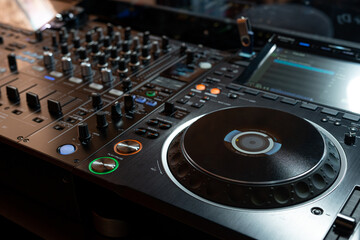 Fototapeta premium Player and mixing console closeup. DJ equipment