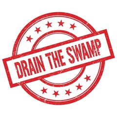 DRAIN THE SWAMP text written on red vintage round stamp.