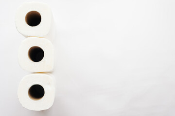 rolls of paper towels, napkins on a white background. White on white, pulp, paper, hygiene. The concept of conscious consumption, sustainable lifestyle. High quality photo