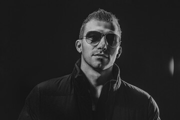 Obraz premium Black and White Brutal confident strong beautiful male model in
