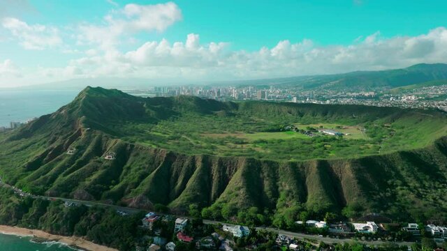 Aerial view of Diamond Head Crater and the Kapi olani Regional Park with Honolulu skyline in the background. Oahu island, Hawaii. United States.