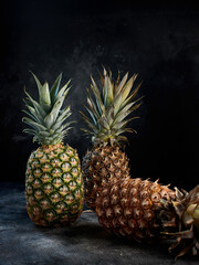 Fresh pineapple on dark background