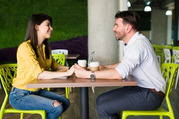 Romantic couple eating together in their lunch break