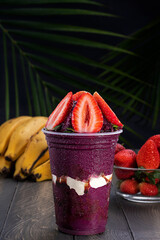 Acai cup with strawberry topping.