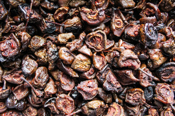 Background of dried halves of pears. Dry brown pears.