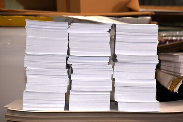 A pile of paper and cardboard in the warehouse of the printing house