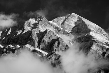 A black and white photograph of Pyramid Mountain in Jasper National Park after a dusting of snow.