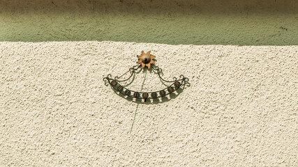 Sun clock on the wall