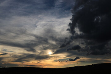 Dramatic sky with clouds by the sunset