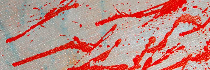 abstract creative background: red blurred spots and splashes with stains of colored primer when toning the canvas, a temporary object.