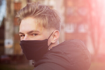 Cute teenage boy in a surgical bandage. Coronavirus, illness, infection, quarantine, medical mask,...