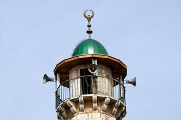 Fototapeta na wymiar Jerusalem: Top of minaret with loudspeakers in East Jerusalem