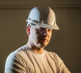 working man construction worker with dirty face looking at camera Close up portrait