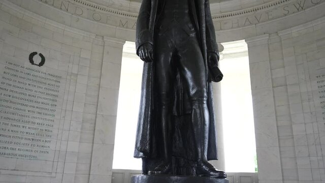 Tilting shot of Thomas Jefferson inside the Jefferson Memorial on the National Mall in Washington, DC.