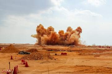 Dust clouds in during detonator blast in the desert