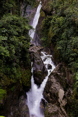 Fototapeta na wymiar A view of el Paolon del diablo from a distance, the most famous waterfall in Ecuador, South America