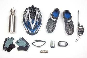 bicycle helmet, glasses, gloves, bottle, walkie-talkie, camera and cycling shoes on a white background