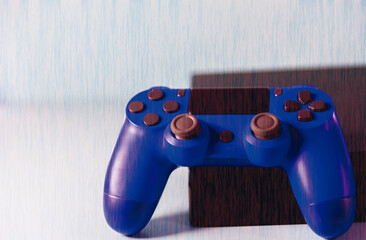 Controls and video game console on light background