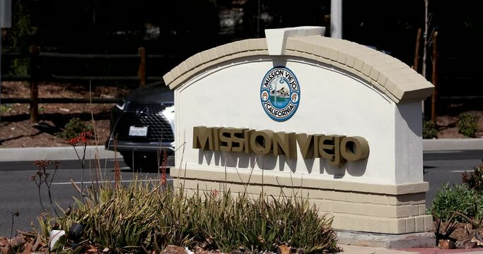 Cars rush past a public city marking sign in Mission Viejo, California, USA.