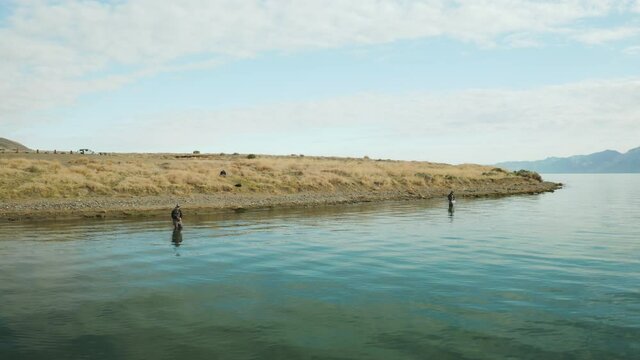Aerial Orbit of Fly Fisherman Casting at Pyramid Lake in Nevada, USA