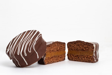Two halves and a whole honey cookies with chocolate named pão de mel, Brazilian dessert.