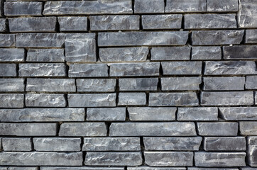 gray brick wall with rough texture