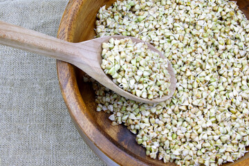 Sprouted buckwheat seeds in wooden plate. Healthy vegan food. Vegetarian food. Nature vitamins. Super food