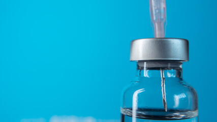Vaccine vial and hypodermic needle